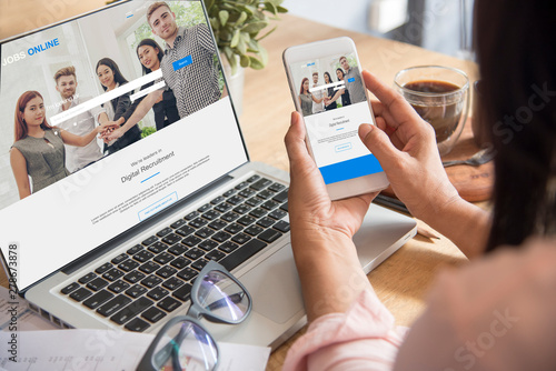 Job seeker  online  recruitment woman hands looking for online jobs from HR head hunter recruitment website.