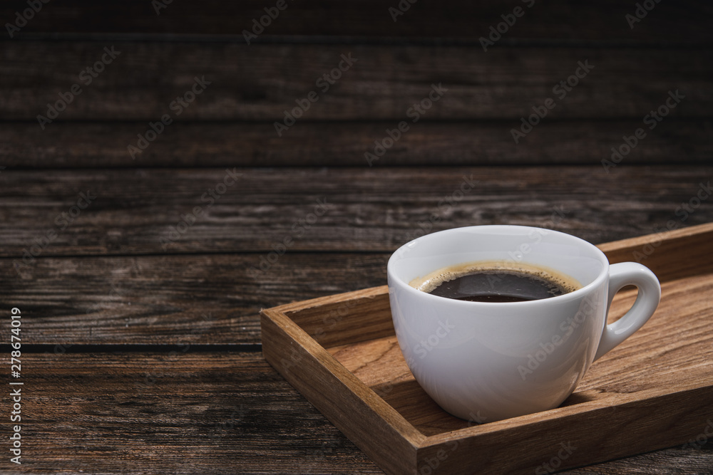 cup of coffee on wooden table cup of coffee on wooden table