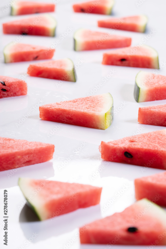 Slices of fresh watermelon on white marble background Slices of fresh watermelon on white marble background