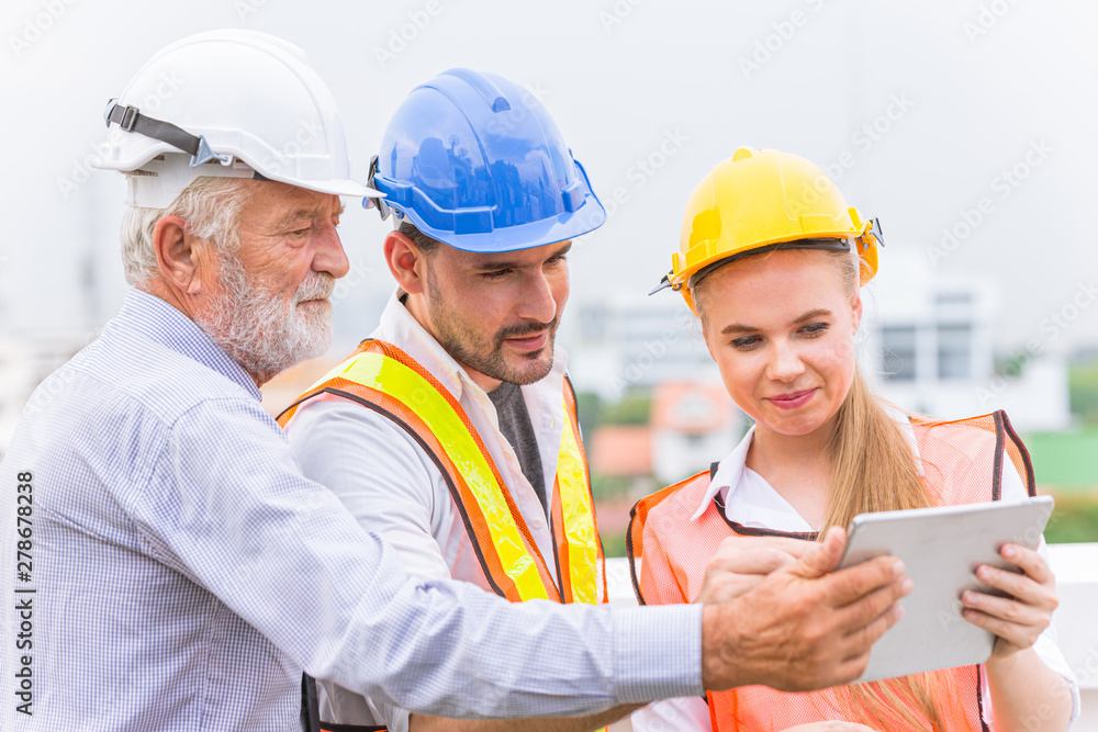 group of builder engineer and architecture using new technology of tablet for inspect building design working join together group of builder engineer and architecture using new technology of tablet for inspect building design working join together