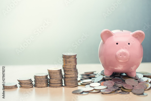 Saving Money concept, Piggy bank with coin for Personal Wealth Income and Profit Fototapeta