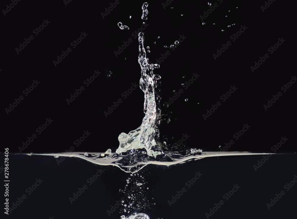 Explosion on liquid surface isolated on black background, close up view. Water bubbles after splash, rippling surface. Abstract black background for overlays design, screen blending mode layer Explosion on liquid surface isolated on black background, close up view. Water bubbles after splash, rippling surface. Abstract black background for overlays design, screen blending mode layer