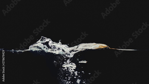 Water bubbles underwater, waving liquid surface isolated on black background, close up view. Abstract liquid splash. Background for overlays design, screen blending mode layer © eriksvoboda