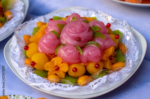 Thai sweet cake. Thai traditional dessert in pink rose flowers shaped. One of nine famous Thai auspicious desserts in Thailand. Rose shape from Khanom Chan
