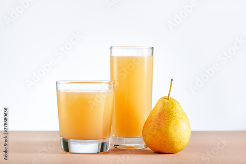 Pear Juice with fresh fruits on table. Copy space.