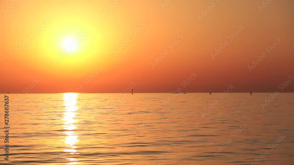 Beautiful sunrise in the beach, orange sky without clouds. Mar Bella beach, Barcelona, Spain. Beautiful sunrise in the beach, orange sky without clouds. Mar Bella beach, Barcelona, Spain.