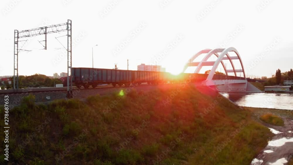 Train With Cargo Containers Moving Down on railway bridge Train With Cargo Containers Moving Down on railway bridge