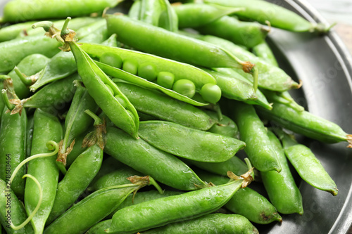 Tasty fresh peas on plate, closeup