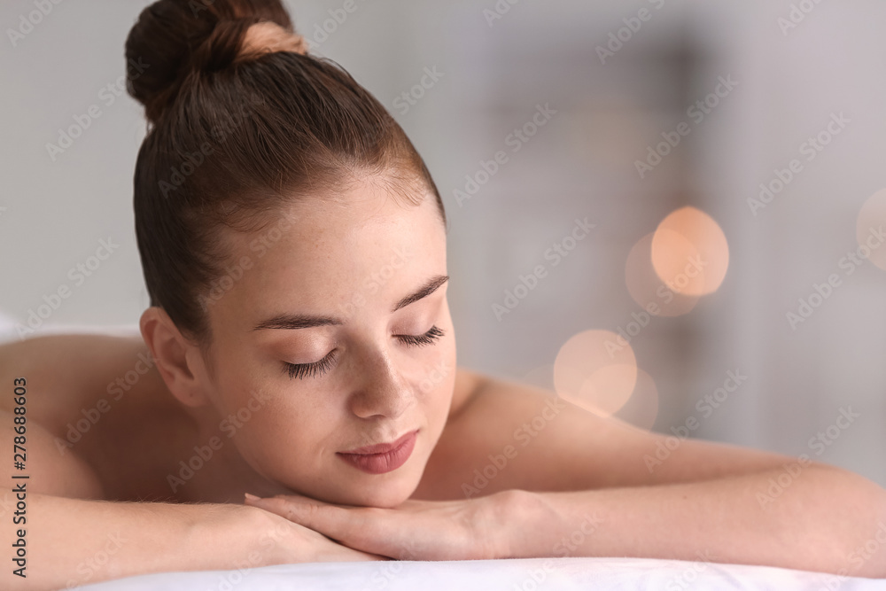 Beautiful young woman relaxing in spa salon Beautiful young woman relaxing in spa salon