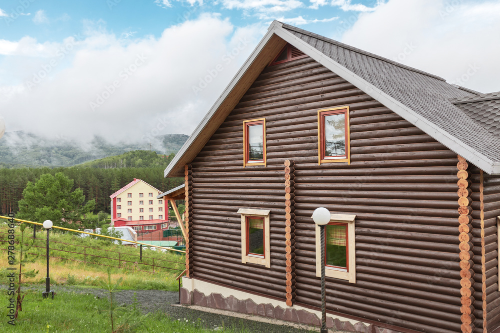 Wooden house as tourist shelter in mountains at summer time