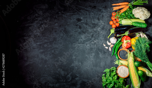 Healthy food background. Concept of healthy food, fresh vegetables on a dark background. Top view whith copy space