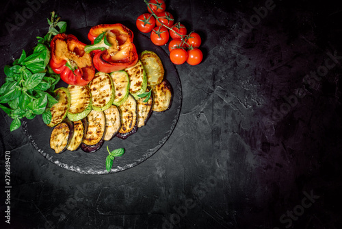 Grilled vegetables on a dark background. Top view whith copy space