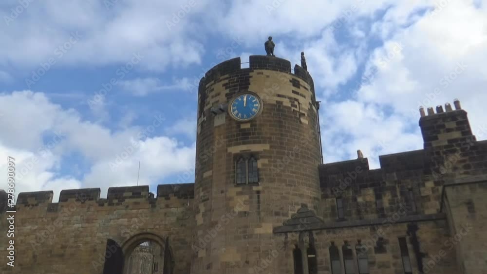 a clocktower in an old British Castle a clocktower in an old British Castle