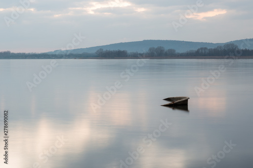 An almost completely sinked little boat in Trasimeno lake (Umbria, Italy) © Massimo