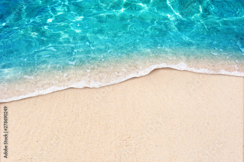 Fototapeta Naklejka Na Ścianę i Meble -  Soft blue ocean wave on clean sandy beach