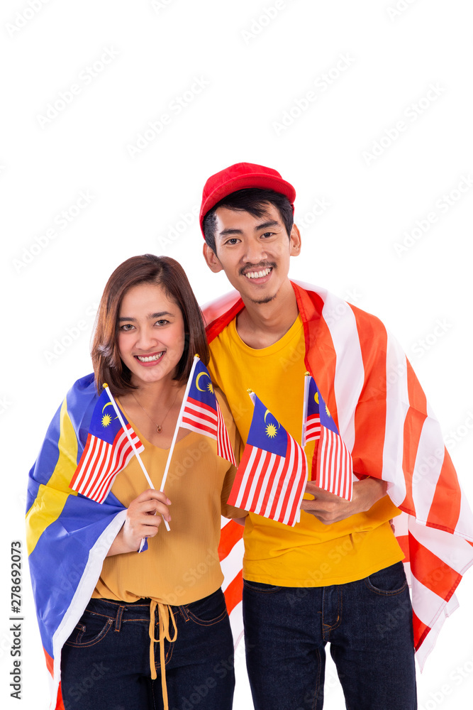malay couple holding malaysia national flag isolated over white background malay couple holding malaysia national flag isolated over white background