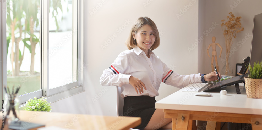 Photo editor working at her desk Photo editor working at her desk
