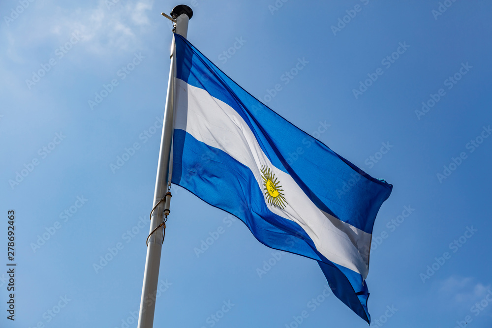 Argentina flag waving against clear blue sky