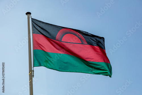Foto Malawi flag waving against clear blue sky