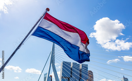 Schilderij op canvas Dutch national flag waving on a boat in Rotterdam