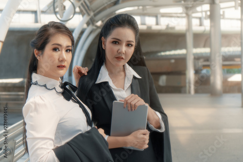 asian business women using table together outdoor