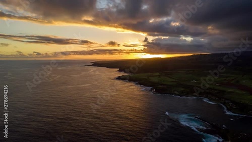 Beautiful Aerial timelapse in motion or hyperlapse on ocean shoreline in Kauai, Hawaii at sunset