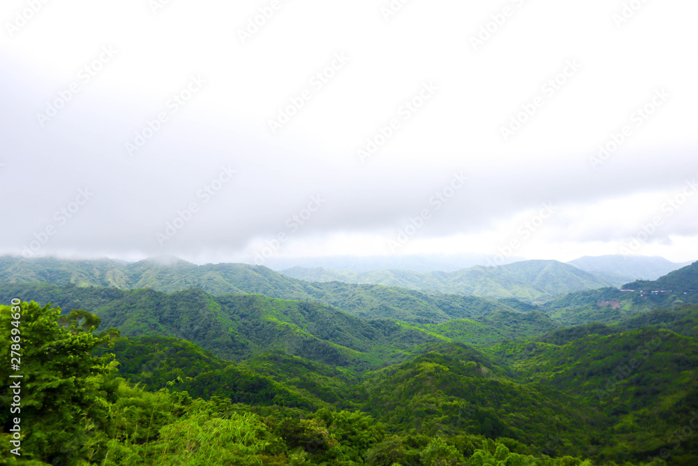 Fototapeta premium Beautiful clounds and fog coverage multiple mountains valley,travel concept.