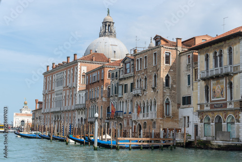 Gondola passing by multicolored buildings