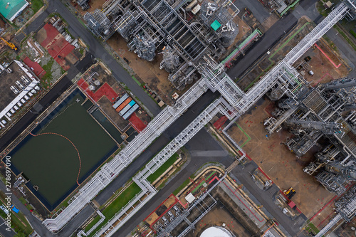 Industrial top view at oil refinery plant form industry zone ,which factory - petrochemical plant, Shot from drone of Oil refinery.evening scenery. © SASITHORN