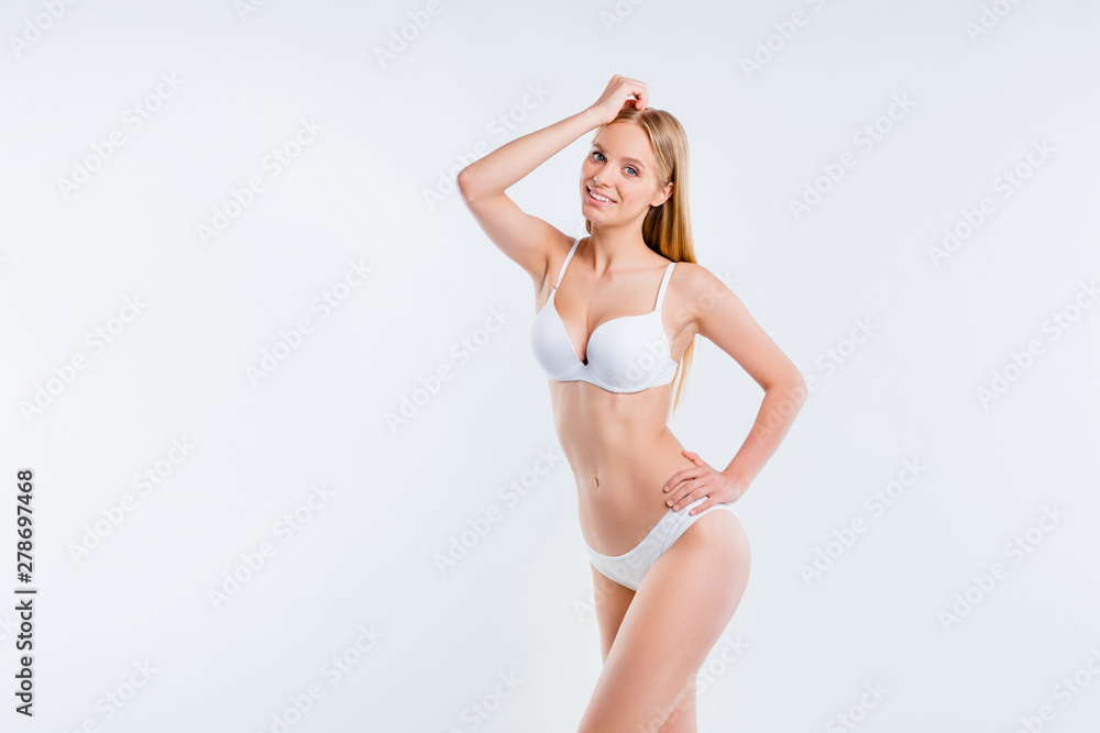 Obraz premium Portrait of nice lovely attractive charming cheerful girl sportive perfect shape fit form curvy line plastic surgery salon procedure isolated over light gray background