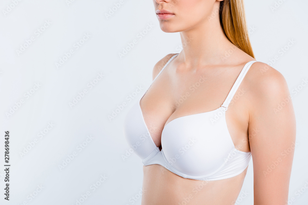 Cropped close-up profile side view of nice gorgeous girl with perfect big  round fit shape chest cancer early diagnostic medical clinic isolated over  light gray background Stock Photo