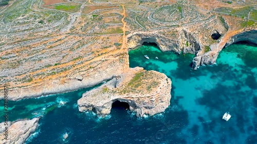 Aerial view from the height of the rocky arches heavenly Blue Lagoon on the island of Comino Malta photo