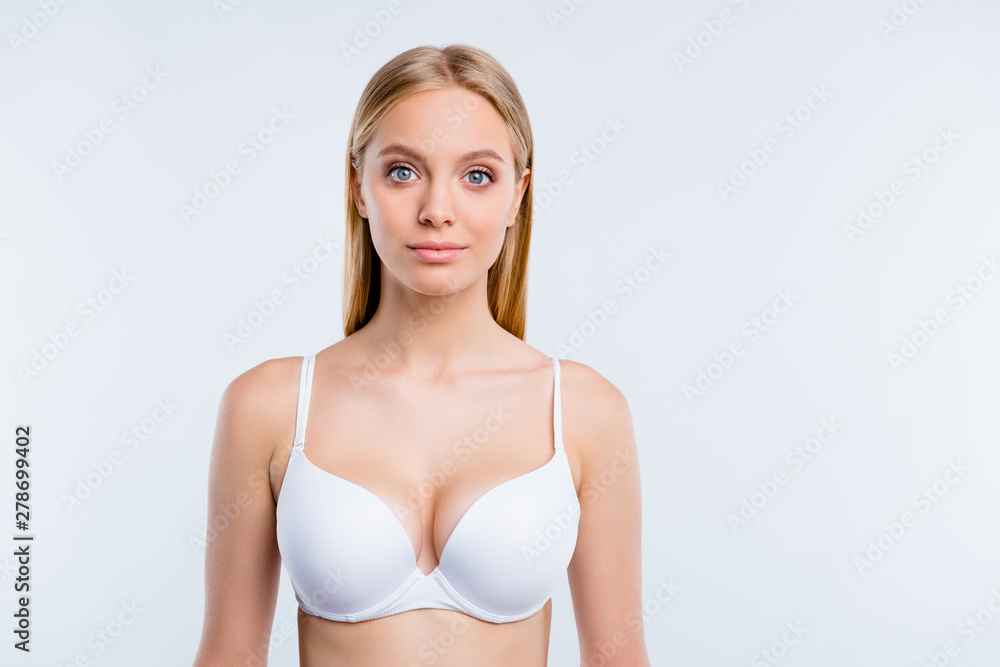 Healthy lifestyle concept. Portrait of nice cute lovely winsome fascinating  attractive blonde girl wearing bra isolated over light gray background Stock  Photo