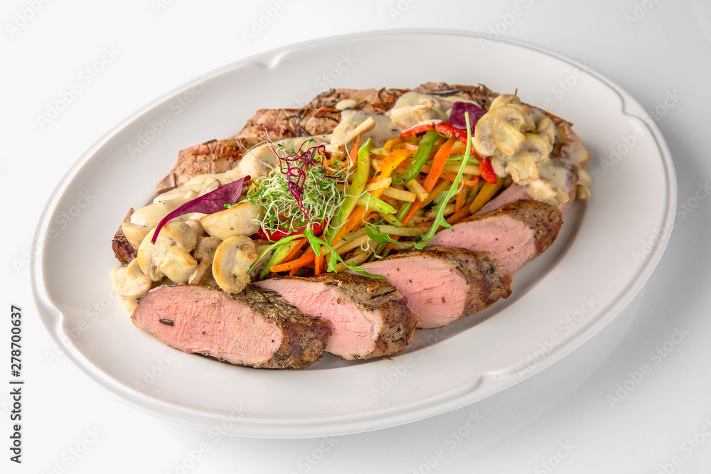 Slicing gourmet meat, pastrami, podcherevka, bastrum, beef and pork. Banquet festive dishes. Gourmet restaurant menu. White background. Slicing gourmet meat, pastrami, podcherevka, bastrum, beef and pork. Banquet festive dishes. Gourmet restaurant menu. White background.