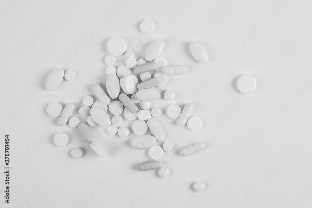 High number of pills on white background surface. High resolution image for pharmaceutical industry. High number of pills on white background surface. High resolution image for pharmaceutical industry.