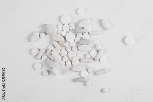 High number of pills on white background surface. High resolution image for pharmaceutical industry.