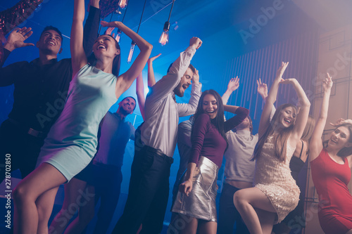 Low angle view photo of charming elegant people person move motion close eyes delighted dress trendy stylish beautiful amuse loud place discotheque