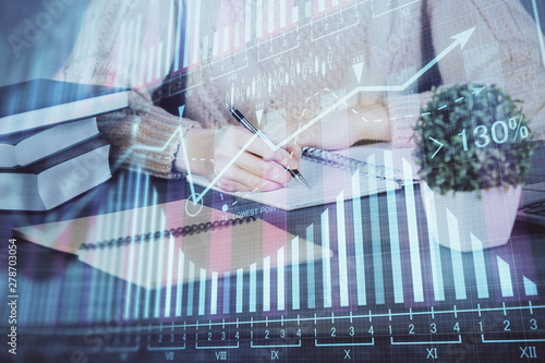 Wallpaper Mural Forex graph on hand taking notes background. Concept of research. Double exposure Torontodigital.ca