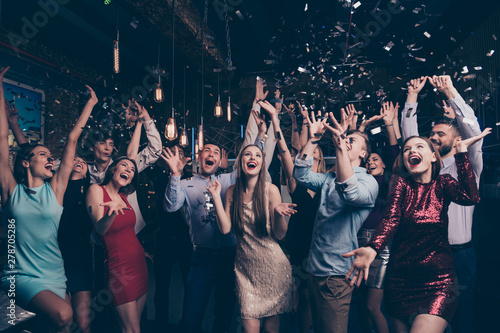 Nice-looking attractive gorgeous glamorous elegant stylish cheerful cheery positive girls and guys having fun bachelor graduate occasion in fashionable luxury place night-club indoors