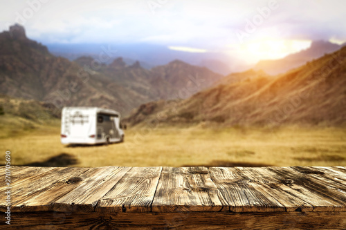 Table background and wooden board, and sunset and camper van © magdal3na