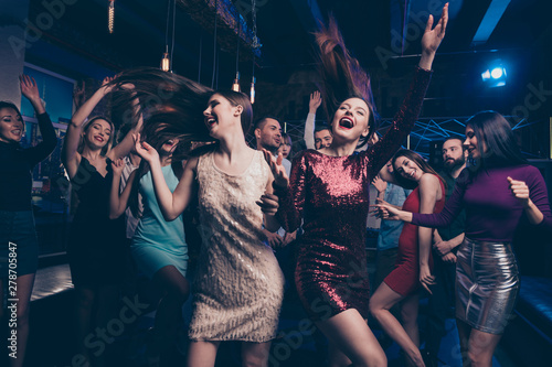 Nice cool gorgeous lovely attractive glamorous cheerful glad positive stylish girls and guys having fun weekend occasion festal celebratory feast in fashionable luxury place night-club indoors