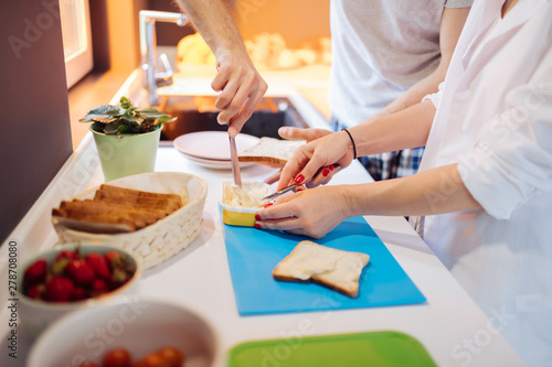 Close up of cheese being taken from the box