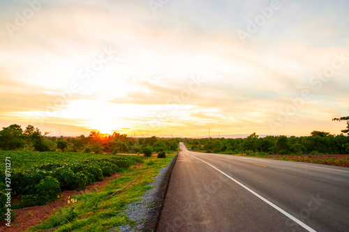 The road in the valley at the time of the sunset Concept of vacation and travel