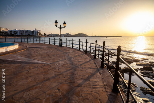 Santa Eularia des Riu, beach, bay and maritime promeande at dawn. Ibiza island, Balearic Islands, Spain.