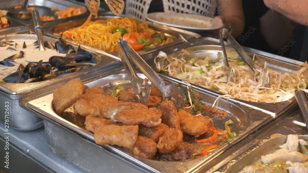 Food trays with hot Asian cuisine. Food trays with hot Asian cuisine.
