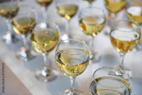 Glasses of white wine on the table