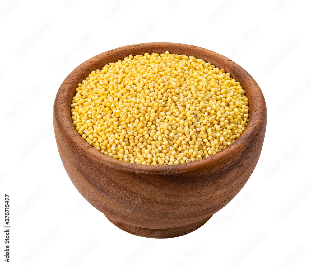 Millet seeds in wooden bowl isolated on white background Millet seeds in wooden bowl isolated on white background