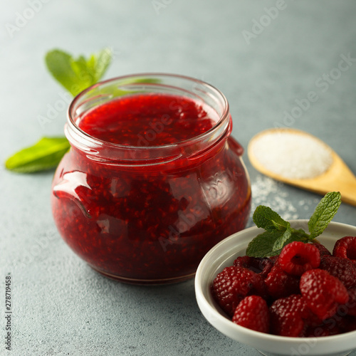 Homemade raspberry jam with fresh mint