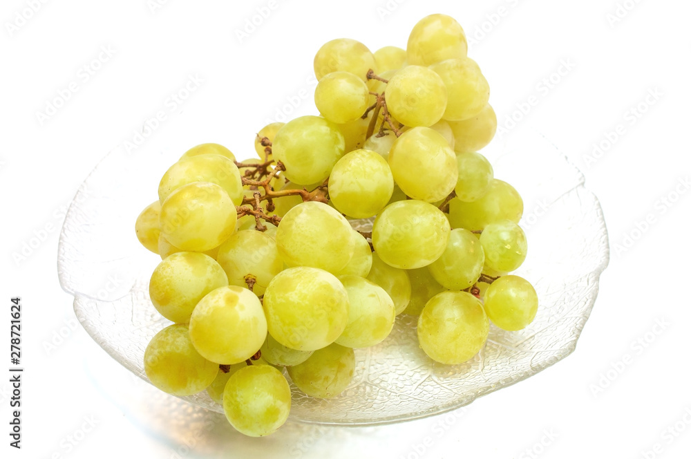 Seedless grapes in a plate isolated on white Seedless grapes in a plate isolated on white