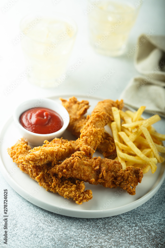 Homemade fish and chips on white plate Homemade fish and chips on white plate